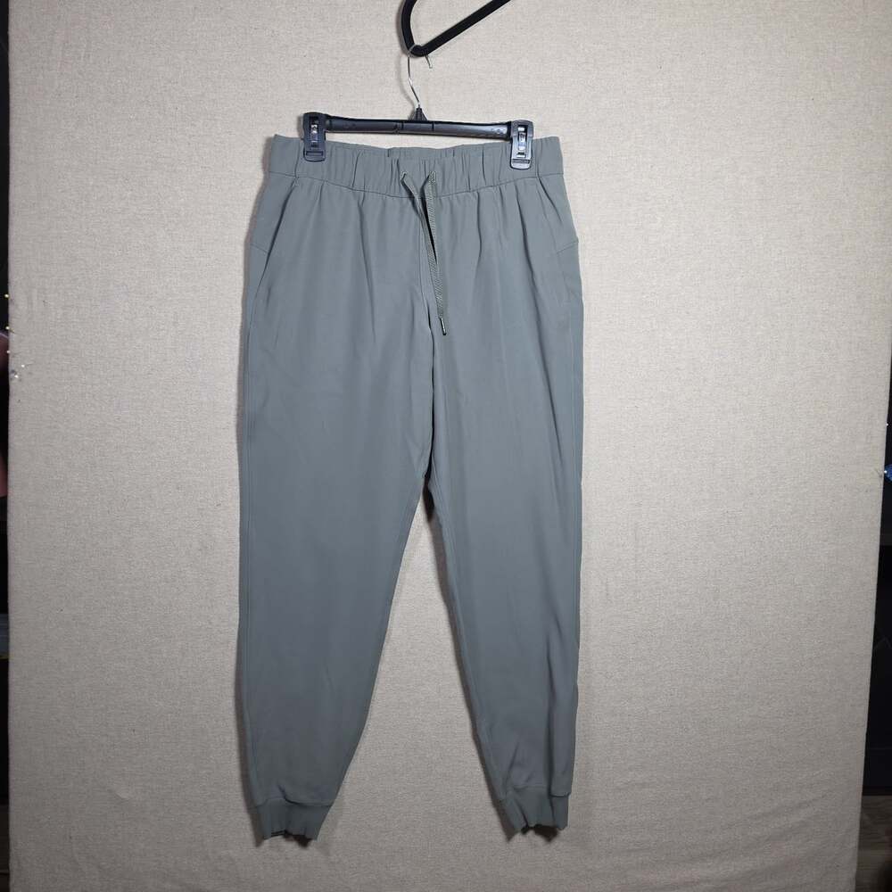 Lululemon On the Fly Jogger Luxtreme Dark Olive Green Pants W5BZDS Size 8 woven